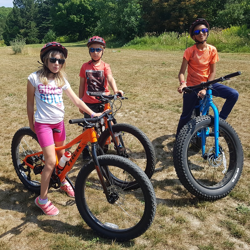 children on bikes at Albion Trails summer camp