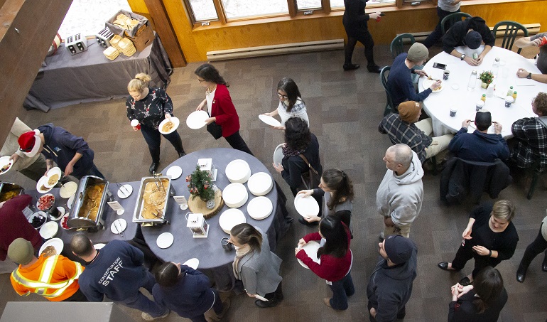 TRCA staff line up for buffet at annual pancake breakfast