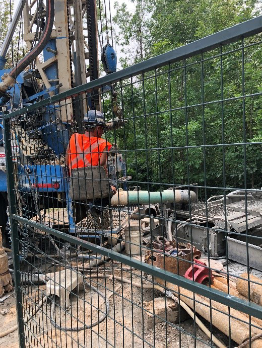 workers install first test well for geothermal system at new TRCA administrative building