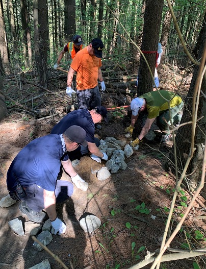 TRCA staff help volunteers repair a section of trail at Albion Hills Conservation Park in Caledon