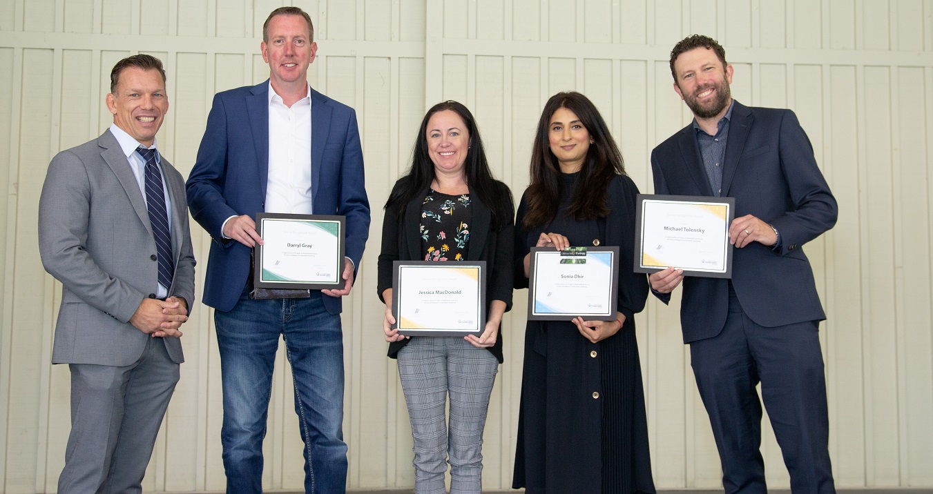 CEO John MacKenzie with SLT Government and Community Relations and CEOs Office Award recipients